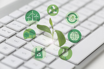 a white keyboard with small images above representing environmental issues