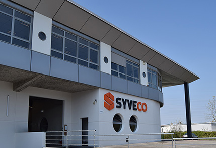 building of Syveco, access to page Our company